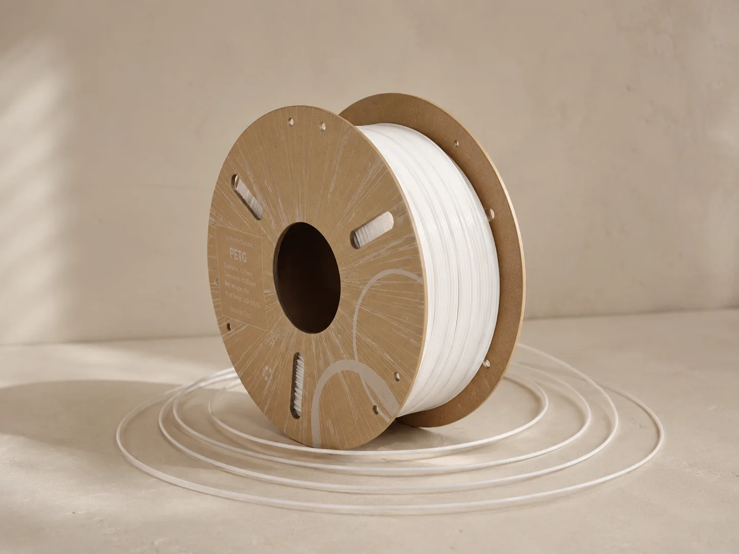 A spool of translucent PETG filament used to print the lamps